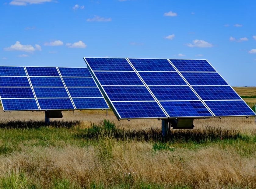 solar panels under a blue sky